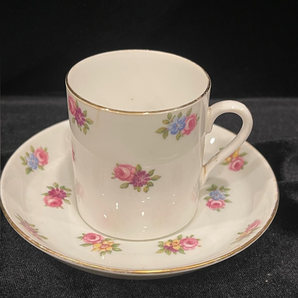 Tuscan Bone China demitasse cup with blue, pink and yellow floral pattern.